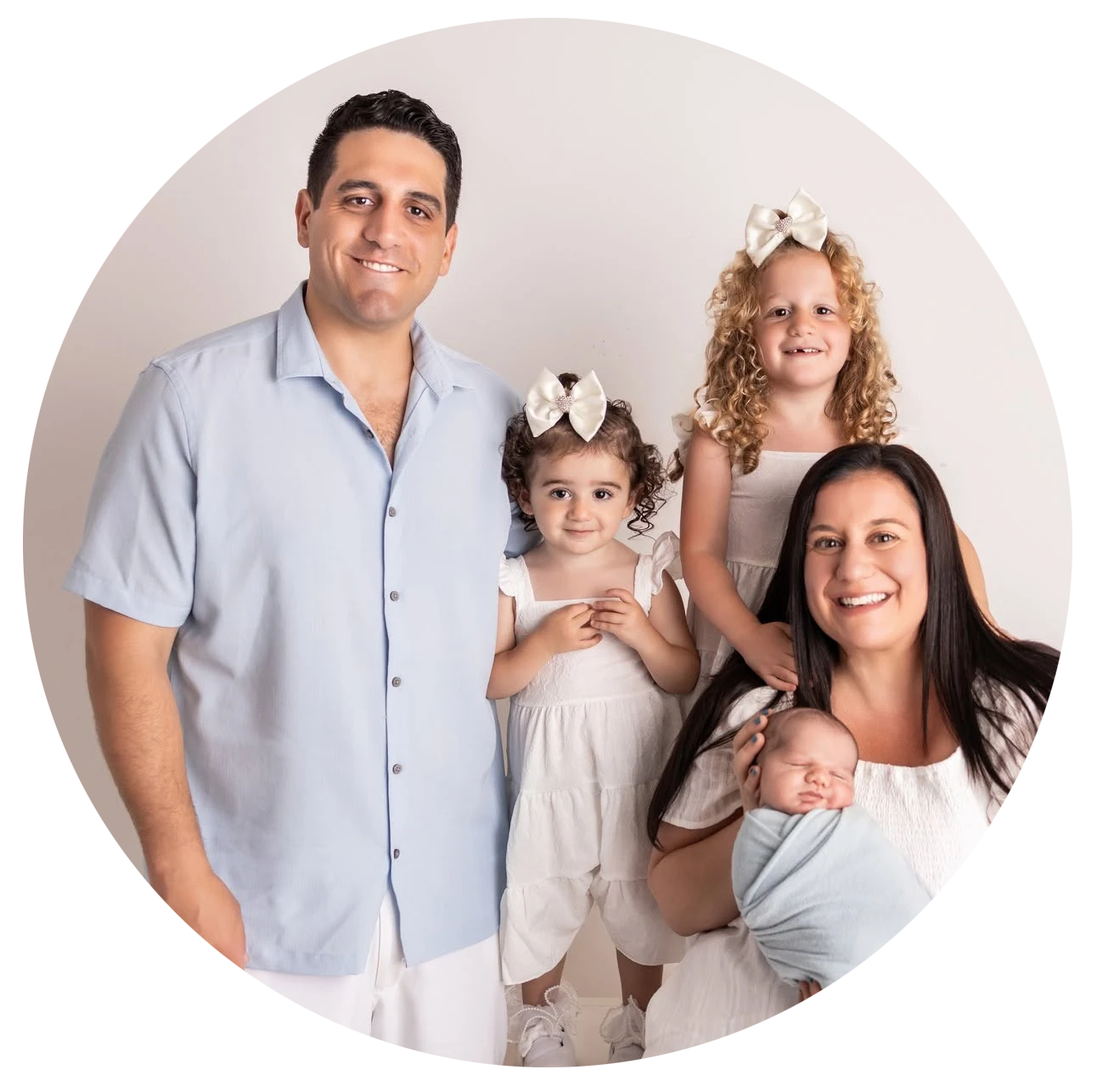 Nicole Muzzio, owner of Colie's Climbers, with her family